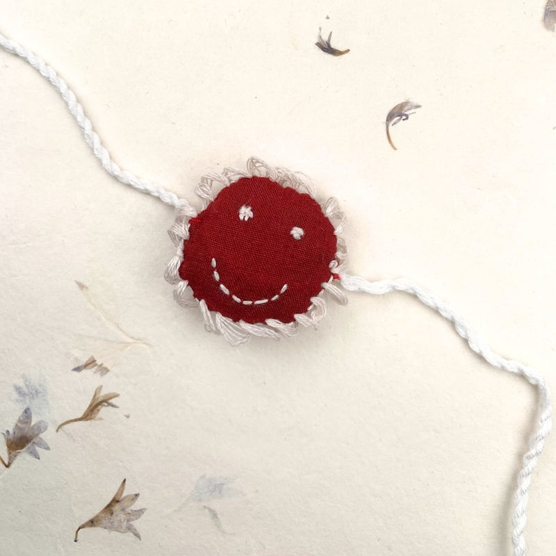 Cheery - Reusable Maroon Smiley Shaped Eco - friendly Kids Rakhi | Verified Sustainable Rakhi on Brown Living™