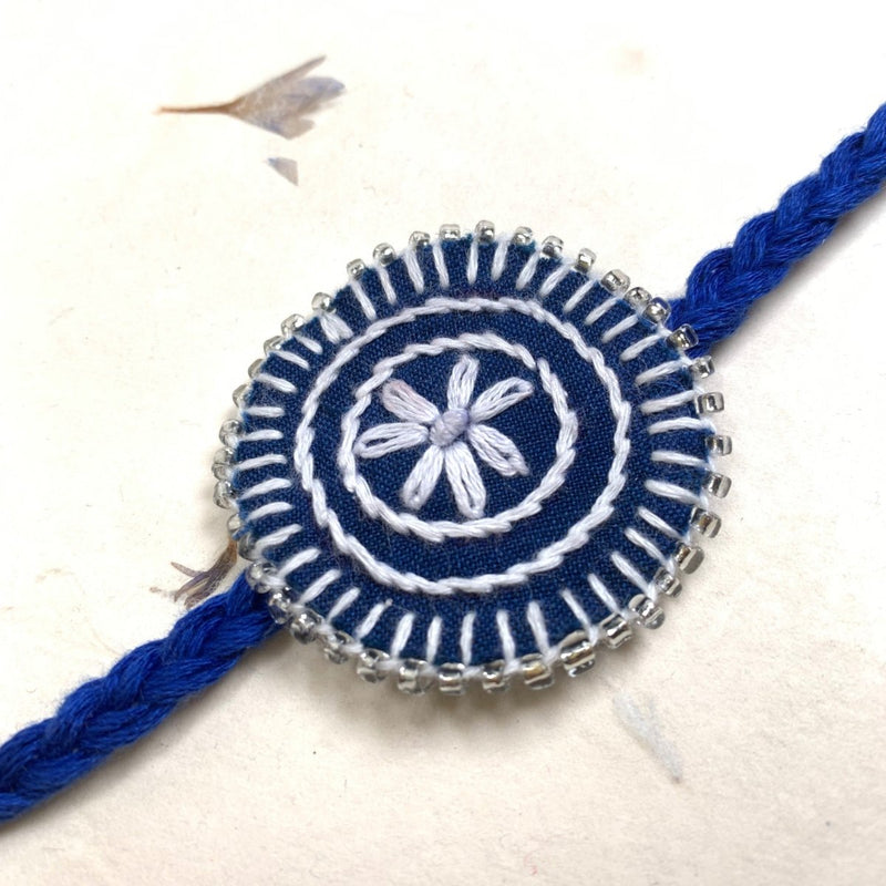 Dual Avtar Hand - embroidered Rakhi - Blue and White| Reusable | Verified Sustainable Rakhi on Brown Living™