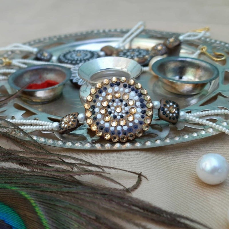 Buy Hand painted pearl shell rakhi | Shop Verified Sustainable Rakhi on Brown Living™